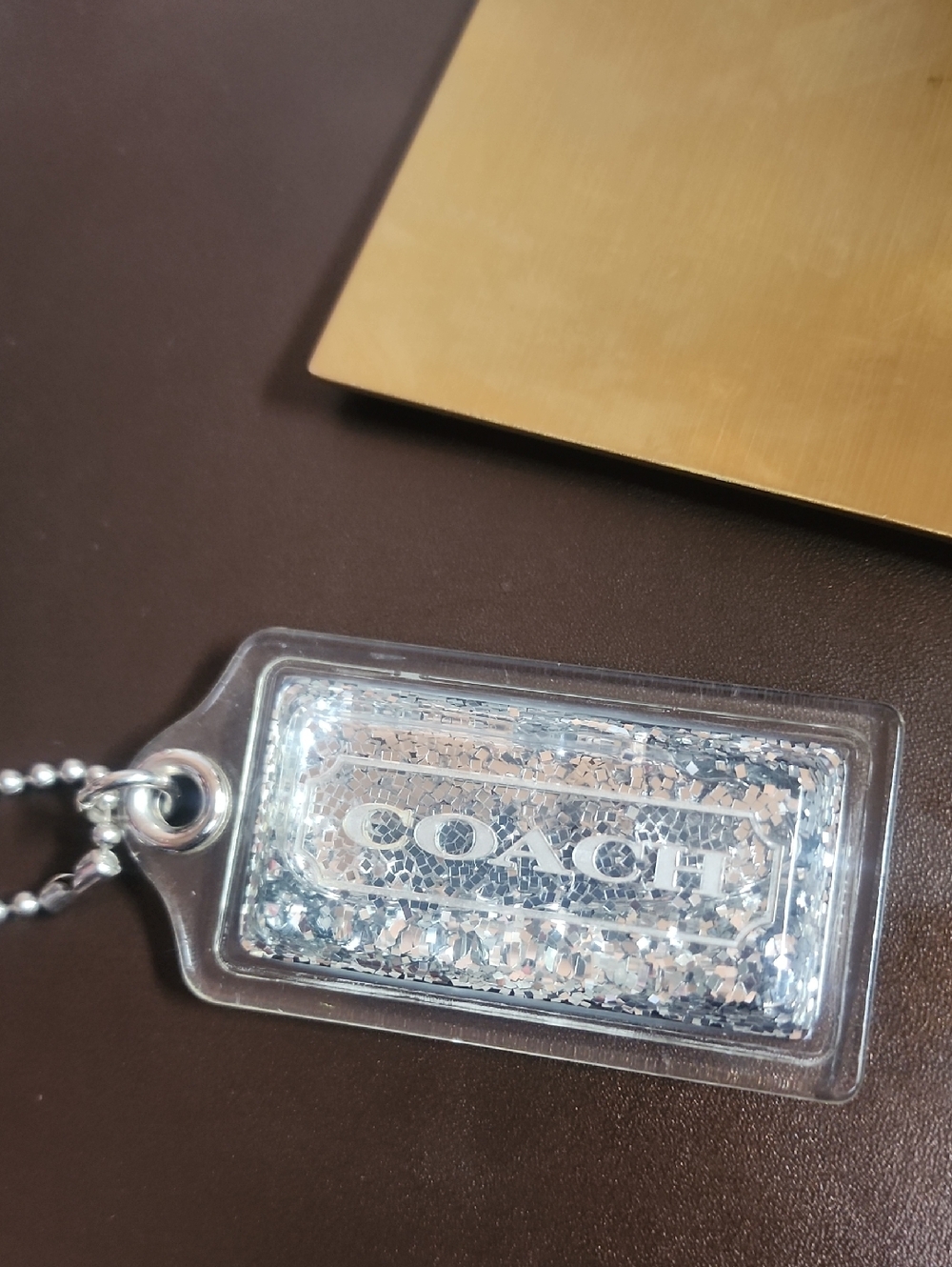 Coach Lg. floating Glitter Shakem Up Hang Tag Euc